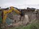 Maquinaria municipal retirando rucos y limpiando el lecho del río Elqui en La Serena