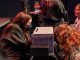Artistas de la Red Lambe Norte presentando teatro en miniatura en Madrid